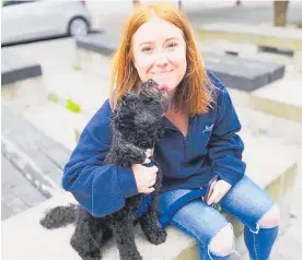  ??  ?? L.T. McGuinness office manager Georgia Robinson, 27, and her dog Lucille.