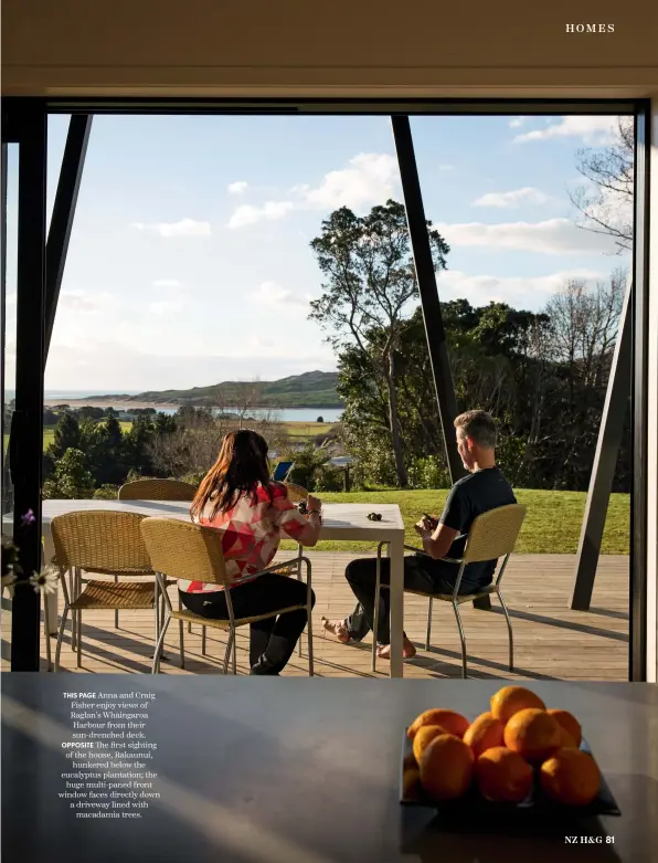  ??  ?? THIS PAGE Anna and Craig Fisher enjoy views of Raglan’s Whāingaroa Harbour from their sun-drenched deck. OPPOSITE The first sighting of the house, Rākaunui, hunkered below the eucalyptus plantation; the huge multi-paned front window faces directly down a driveway lined with macadamia trees.