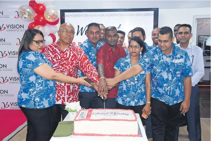  ?? Picture: REINAL CHAND ?? Vision Investment Ltd Service manager Cabe Takayawa (2nd from left) with employees cut a cake to celebrate the opening of the Vision Commercial Showroom in Namaka Nadi.