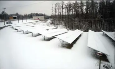  ?? TANIA BARRICKLO — DAILY FREEMAN ?? The state Bridge Authority’s new solar array at the west end of the Kingston-Rhinecliff Bridge was covered with snow Monday, the day it was turned on. The array comprises 1,332 panels.