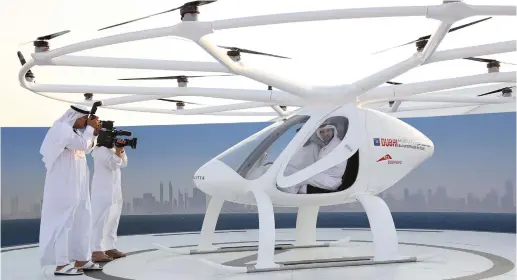  ?? (Reuters) ?? DUBAI CROWN PRINCE Sheikh Hamdan bin Mohammed bin Rashid Al Maktoum is seen inside the flying taxi in Dubai, United Arab Emirates, in September.