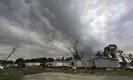  ?? Photograph: Leslie Westbrook/AP ?? Dark clouds hang over Bradley Lane after a tornado destroyed several mobile homes in New Iberia, Louisiana Wednesday.