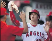  ?? RONALD MARTINEZ — GETTY IMAGES ?? The Angels’ Shohei Ohtani celebrates after scoring a run in the first inning against the Baltimore Orioles at Angel Stadium in Anaheim. The Angels defeated the Orioles 4-1 on Saturday.