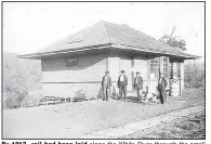  ?? ?? By 1913, rail had been laid along the White River through the small towns of Combs, St. Paul and on to Pettigrew. This Delaney Depot is in St. Paul.