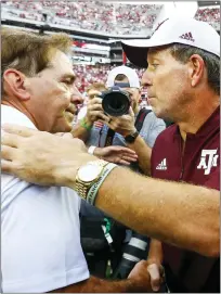  ?? ASSOCIATED PRESS FILE PHOTO ?? Alabama head coach Nick Saban shakes hands with Texas A&M head coach Jimbo Fisher after the end of a game, Sept. 22, 2018, in Tuscaloosa, Ala.