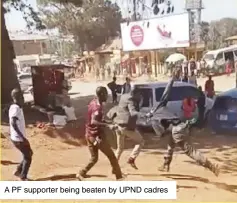  ??  ?? A PF supporter being beaten by UPND cadres