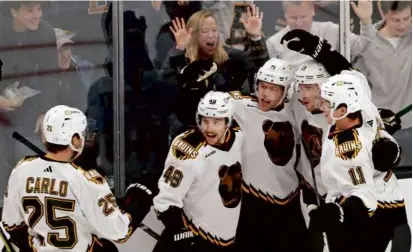  ?? JIM DAVIS/GLOBE STAFF ?? Taylor Hall was in the middle of the celebratio­n after scoring at 1:07 of the first period.