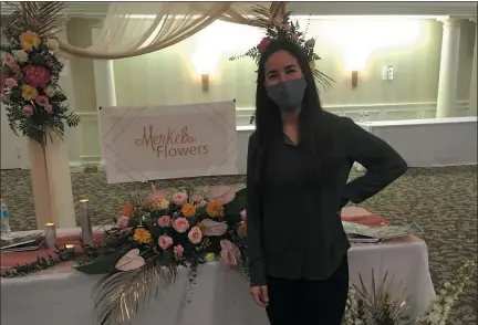  ?? ANDREW CASS - THE NEWS-HERALD ?? Kristin Brewster Goodell, owner of Merkel’s Flowers in Willoughby, was among the vendors in attendance Nov. 8 at the We Thee Wed wedding show at the Villa Croatia Party Center in Eastlake.
