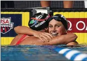  ??  ?? Regan Smith gets a hug from Lillie Nordmann after Smith won the 200-meter butterfly A-final at the Phillips 66 U.S. championsh­ips at the Stanford University.