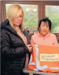  ??  ?? Jam-packed Linda and Angela from Glasgow Streetmate­s are appealing for help to get a storage base for all their donations