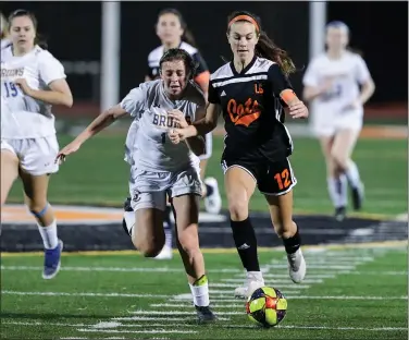  ?? PHOTO BY KEITH THARP ?? Los Gatos High School’s Emily Nedom (12) beats a Santa Clara defender to the ball and races toward the goal for a shot. Los Gatos tied Santa Clara 2 -2 in this Santa Clara Valley Athletic League De Anza Division girls soccer game on Feb. 14.