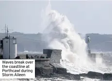  ??  ?? Waves break over the coastline at Porthcawl during Storm Aileen