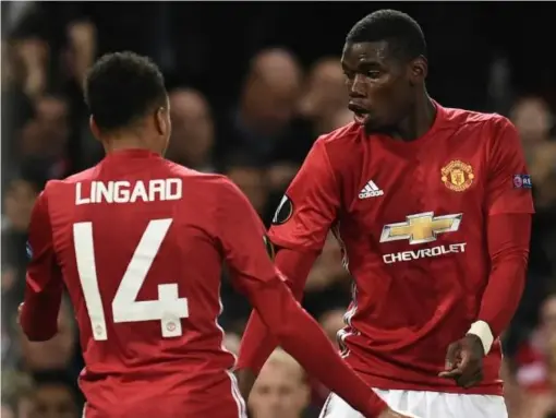  ??  ?? Lingard celebrates his well-taken goal with Pogba (Getty)