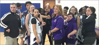  ?? Photo by Brendan McGair ?? The St. Raphael girls’ basketball team, pictured Friday night at the Boys & Girls Club of Pawtucket, successful­ly defended its Donaldson-Lynch Tournament.