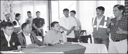  ??  ?? Eulalio Austin Jr., CEO and president of Philex Mining, briefs Environmen­t Secretary Roy Cimatu; Ralph Pablo, regional director of DENR-CAR; and DENR Assistant Secretary for Field Operations–Luzon Juan Miguel Cuna about the integrity of Padcal mine’s...