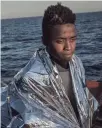  ??  ?? Refugees and migrants are seen aboard the Migrant Offshore Aid Station Phoenix vessel after being rescued at sea June 10 off Lampedusa, Italy.