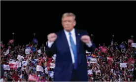  ?? Photograph: Brendan Smialowski/AFP/Getty Images ?? Donald Trump at a campaign rally on Thursday in Jacksonvil­le, Florida.