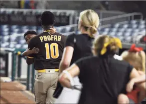  ?? Mitchell Layton / Getty Images ?? The Padres’ Jurickson Profar runs off the field with family after shots were heard during a game agaisnt Washington Nationals at Nationals Park on Saturday in Washington, D.C.