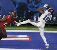  ?? PHOTO/COREY SIPKIN
AP ?? New York Giants’ Golden Tate, right, catches a touchdown in front of Tampa Bay Buccaneers’ Sean Murphy-Bunting during the second half of an NFL football game, Monday, in East Rutherford, N.J.