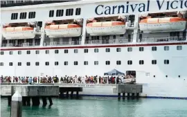 ?? CAMMY CLARK Miami Herald file, 2013 ?? In November, more than 60% of Key West voters decided to ban cruise ships with a capacity of more than 1,300 people from docking in the city and to limit the number of cruise visitors who can disembark each day to 1,500.