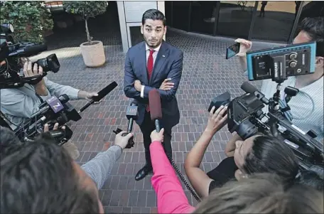  ?? Hayne Palmour IV San Diego Union-Tribune ?? AMMAR Campa-Najjar addresses the media outside the courthouse in San Diego where Rep. Duncan Hunter and his wife were arraigned.