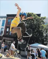  ?? CLIFFORD SKARSTEDT EXAMINER ?? Tom Sullivan shows off his bag of skateboard tricks during the third annual Peterborou­gh Pulse event on July 15, 2017 in downtown Peterborou­gh. This year’s festival will close down sections of George and Charlotte streets on Saturday.