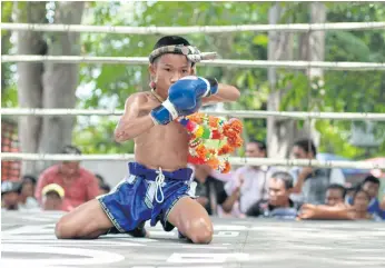  ??  ?? RISING STAR: Anupong ‘Bpaet’ Pongkan, a 14-year-old up-and-coming muay Thai fighter who was among the first to join the Wor Watthana gym. He is a regular participan­t in amateur fights.