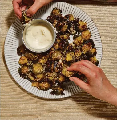  ?? Photos: Louise Hagger/PA ?? Get crunching with these smashed Brussels sprouts from Celebrate: Plant-Based Recipes for Every Occasion.