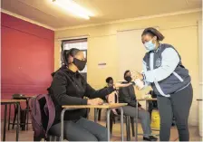  ?? News Agency (ANA)
TIMOTHY BERNARD ?? FOLLOWING uncertaint­y last week, schooling went ahead yesterday morning at the Kliptown Secondary School. The school spent extra time preparing and sending out a video to inform learners about all the procedures when returning to school. | African