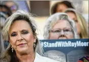  ?? DREW ANGERER/GETTY IMAGES ?? Kayla Moore, wife of Roy Moore, looks on during a “Women For Moore” rally in support of Republican candidate for U.S. Senate Roy Moore, in Montgomery, Alabama, on Friday.