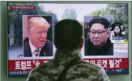  ?? AHN YOUNG-JOON - THE ASSOCIATED PRESS ?? A man watches a TV screen showing images of U.S. President Donald Trump, left, and North Korean leader Kim Jong Un during a news program at the Seoul Railway Station in Seoul, South Korea, Saturday, Feb. 9. Trump said Friday that he will hold his second summit with Kim in Hanoi and predicted that the authoritar­ian country would someday become “a great Economic Powerhouse” under Kim’s leadership. Korean letters on the screen read: “North Korea will become a different kind of rocket - an economic one!”