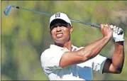  ?? [RYAN KANG/THE ASSOCIATED PRESS] ?? Tiger Woods shot 5-over-par 76 on Friday and missed the cut in the Genesis Open for the first time in nine appearance­s as a pro.