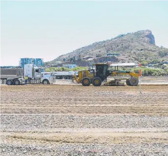  ?? GROWTH DRIVER: Mendi constructi­on trucks at the Townsville stadium site. Picture: WESLEY MONTS ??