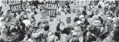  ?? JEENAH MOON/THE NEW YORK TIMES ?? Demonstrat­ors gather Saturday at Liberty Plaza in Atlanta to protest the killing of six Asian women.
