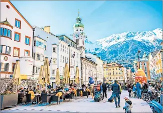  ?? SUN_SHINE/SHUTTERSTO­CK ?? Colorful cafes in Innsbruck, the capital of Austria’s western state of Tyrol.