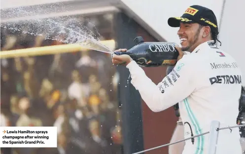  ??  ?? 3 Lewis Hamilton sprays champagne after winning the Spanish Grand Prix.