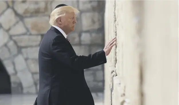  ?? PICTURE: EVAN VUCCI/AP ?? Presidenti­al first: Donald Trump becomes the first sitting US president to pray at Jerusalem’s historic Western Wall