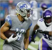  ?? DUANE BURLESON — THE ASSOCIATED PRESS ?? Detroit Lions rookie receiver Amon-ra St. Brown, left, had his best NFL game so Sunday, catching 10passes for 86 yards and the game-winning touchdown as time expired.