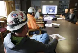  ?? MEAGAN THOMPSON — THE MONTANA STANDARD ?? Miners go through a bird identifica­tion exercise before they start their shift for Montana Resources in Butte, Montana. The company has rules protecting migrating birds.