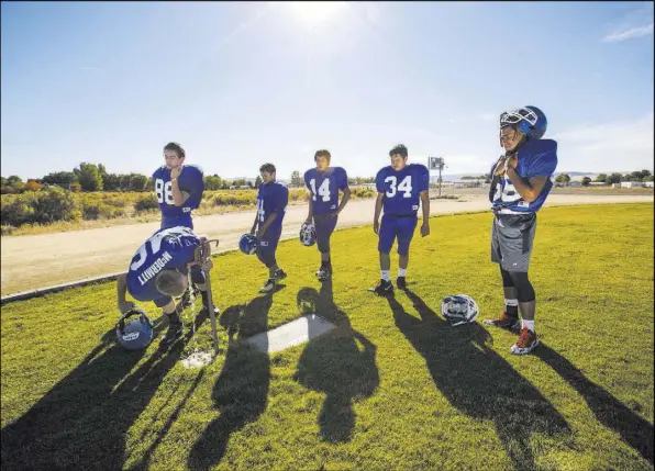  ?? Chase Stevens Las Vegas Review-Journal @csstevensp­hoto ?? Bulldog football players hydrate during practice Sept. 25 at McDermitt Combined School in McDermitt.