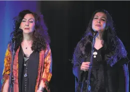  ??  ?? Iranian sisters Mahsa ( left) and Marjan Vahdat have sung together in Europe and the U. S. while unable to perform in their home country.