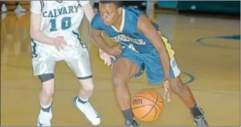  ?? Photo by Steve Sherman ?? Morrisvill­e senior point guard Davae Watson drives the ball into the paint in last Friday’s Bulldogs’ battle at Calvary Christian won by the Cougars.