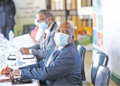  ?? Picture: Nigel Sibanda ?? SOFT INCENTIVES. Minister of Health Joe Phaahla, with his deputy Sibongisen­i Dlomo, briefs the media on the national vaccinatio­n roll-out programme at the Chris Hani Baragwanat­h Hospital vaccinatio­n site in Soweto yesterday.