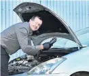  ?? PHOTO: PETER MCINTOSH ?? Charged and ready . . . AA Auto Centre Dunedin service manager Shaun Fairbairn checks a car battery to make sure it is fully charged.