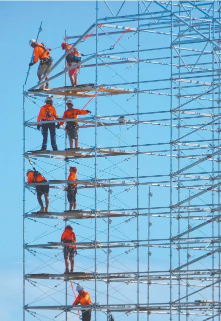  ??  ?? Scaffoldin­g is going up to provide temporary seating at Gold Coast Aquatic Centre for the Commonweal­th Games.