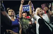  ?? PHOTO: REUTERS ?? Angry . . . Supporters of US President Donald Trump gather in front of the Maricopa County Tabulation and Election Centre to protest against the results of the 2020 presidenti­al election, in Phoenix, Arizona yesterday.