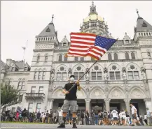  ?? Jessica Hill / Associated Press ?? A “Back the Blue” rally to show support for law enforcemen­t officers stand outside the State Capitol, Thursday in Hartford.