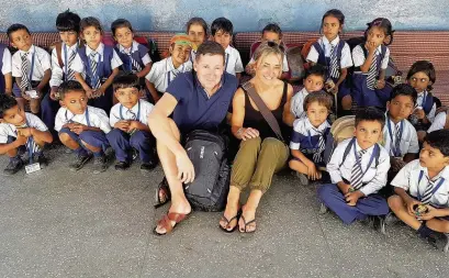  ??  ?? Tim Robey with business partner Susan at a school in India