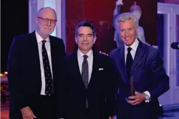  ??  ?? Vincenti with John Ellery - FEPE MD and Jean-françois Decaux - Chairman and CO-CEO of Jcdecaux, receiving the FEPE Lifetime Achievemen­t Award 2015 on behalf of his father Jean-claude Decaux.