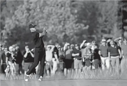  ?? GETTY IMAGES ?? Brooks Koepka tees off during the third round on his way to an even-par 70 Saturday at Bethpage Black. He leads the PGA Championsh­ip by seven strokes heading into the final round Sunday.